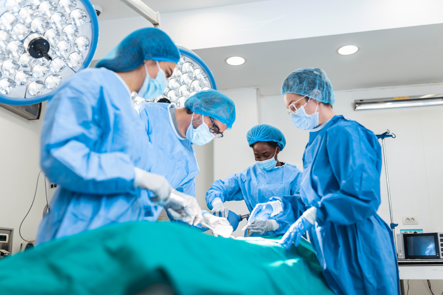 Doctor and assistant nurse operating for help patient from dangerous emergency case .Surgical instruments on the sterile table in the emergency operation room in the hospital.Health care and Medical